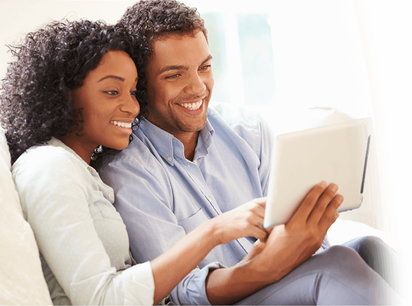 couple-looking-at-tablet couple looking at tablet