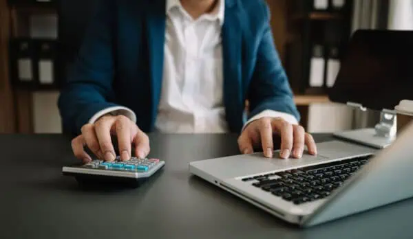 A person calculating healthcare fees